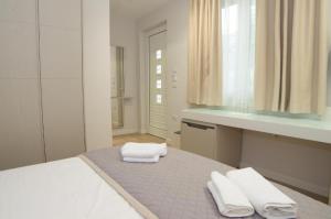 Postel nebo postele na pokoji v ubytování Hotel Vila Kalcuni Sarande