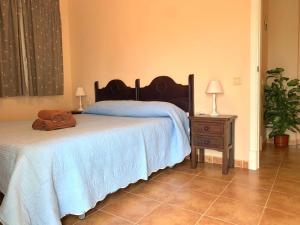 Postel nebo postele na pokoji v ubytování Apartamentos San Bruno Canela