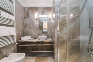 a bathroom with a sink and a shower at Hotel Paganelli in Venice +132 photos