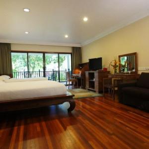 a bedroom with a bed and a living room at Cyberview Resort & Spa in Cyberjaya