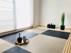 a living room with a black and white floor at Corner6 in Kyoto