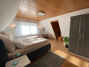 a bedroom with a large bed and a window at Ferienhaus Spreewald in Luckau
