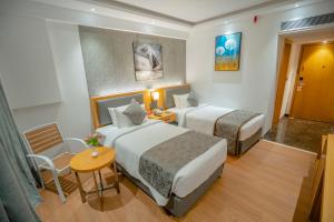 Postel nebo postele na pokoji v ubytování Zip By Spree Hotels Chakan, Pune