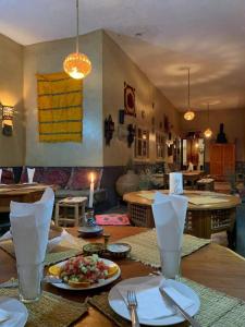 a table with a plate of food on top of it at Kasbah Citoyenne in Agoudal