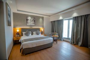Postel nebo postele na pokoji v ubytování Zip By Spree Hotels Chakan, Pune
