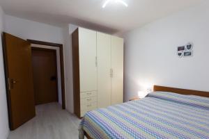 Katil atau katil-katil dalam bilik di Appartamento Speranza