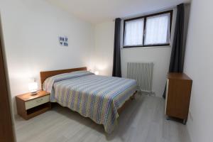 Katil atau katil-katil dalam bilik di Appartamento Speranza