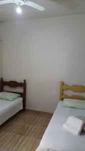 En eller flere senge i et værelse på Pousada Bem Viver 1