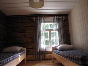 Postelja oz. postelje v sobi nastanitve Mandjala Puhketalu - Cottages