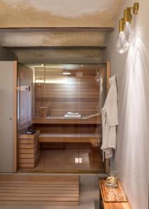 a bathroom with a shower with a glass wall at Antica Dimora Le Misure in Cervia