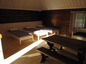 Postelja oz. postelje v sobi nastanitve Mandjala Puhketalu - Cottages