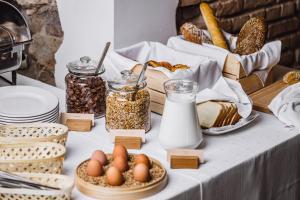 a table with bread and other food items on it at Moon Garden in Vilnius