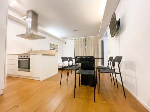 Kuchyňa alebo kuchynka v ubytovaní La Pigna Boutique Apartment