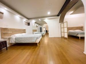 Posteľ alebo postele v izbe v ubytovaní La Pigna Boutique Apartment