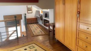 a living room with a staircase and a dining room at Vivienda turistica con encanto centrico, wifi y patio in Bilbao