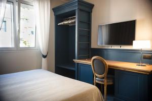 Postel nebo postele na pokoji v ubytování MH HOTEL VARAZZE