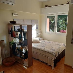 a bedroom with a bed and a book shelf at Loggia Portofino in Rapallo +5 photos