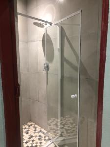 Een badkamer bij Pozi Guest House