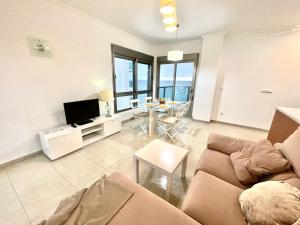 Μια τηλεόραση ή/και κέντρο ψυχαγωγίας στο La Manga Apartamento - primera linea