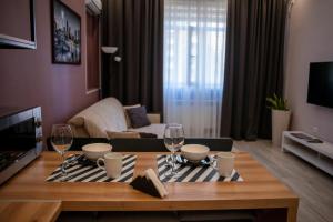 Et tv og/eller underholdning på Terra Cotta Apartment in Aktau