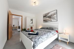 a bedroom with a large bed in a room at Aria Apartment - Free Parking in Bioggio