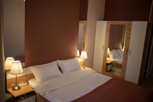 En eller flere senge i et værelse på Terra Cotta Apartment in Aktau