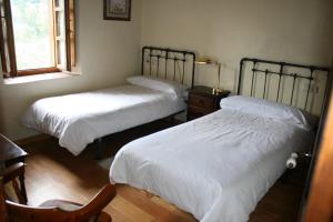 Giường trong phòng chung tại Casa del Tesoro