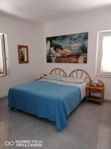 En eller flere senge i et værelse på Mareluna Casa Del Mare