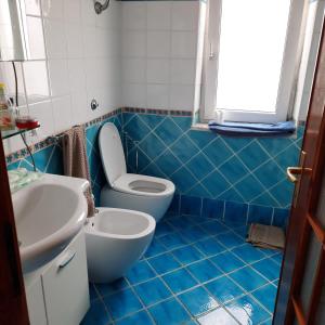 Et badeværelse på Mareluna Casa Del Mare