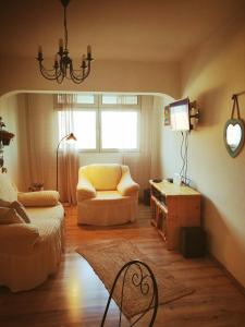 a living room with a couch and a chair at Apartment Fortuna in Korčula