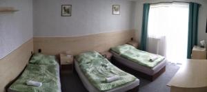 Posteľ alebo postele v izbe v ubytovaní Penzion KASPEC