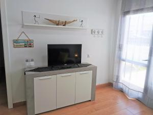 Telewizja i/lub zestaw kina domowego w obiekcie La Casita del Sol