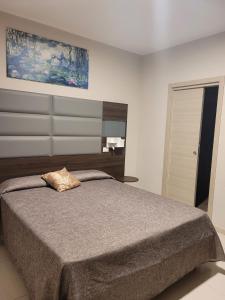 Postel nebo postele na pokoji v ubytování Hotel Casale dei Greci