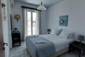 A bed or beds in a room at Ionion Apartments