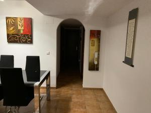 Posezení v ubytování Apartamento con jardín privado y acceso a piscina