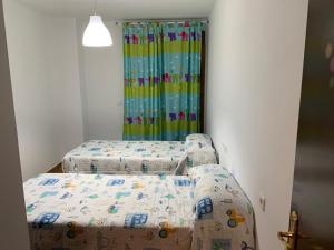 Postel nebo postele na pokoji v ubytování Apartamento con jardín privado y acceso a piscina