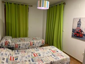 Postel nebo postele na pokoji v ubytování Apartamento con jardín privado y acceso a piscina