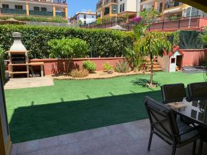 Zahrada ubytování Apartamento con jardín privado y acceso a piscina