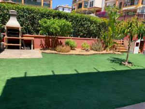 Zahrada ubytování Apartamento con jardín privado y acceso a piscina