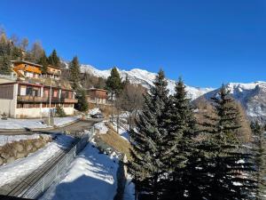 a winter view of a mountain with snow and trees at ORCIERES APPARTEMENT 6 PERSONNES AVEC PARKING in Orcières