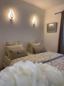 two beds sitting next to each other in a room at Gîte les 2 cèdres in Cardet