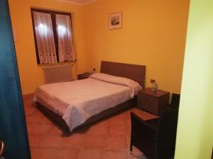 Postel nebo postele na pokoji v ubytování Albergo Breglia