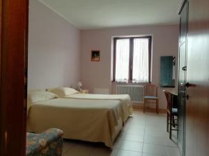 Vuode tai vuoteita majoituspaikassa Albergo Breglia