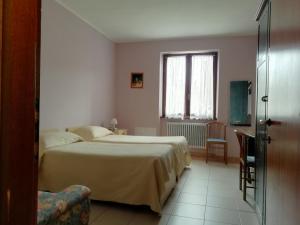 Postel nebo postele na pokoji v ubytování Albergo Breglia