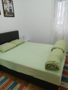 Ein Bett oder Betten in einem Zimmer der Unterkunft Center Sunrise Apartment