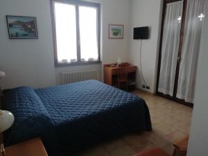 Postel nebo postele na pokoji v ubytování Albergo Breglia