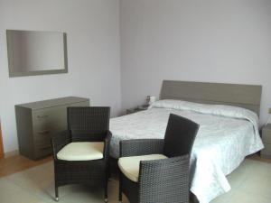 Postel nebo postele na pokoji v ubytování Albergo Breglia