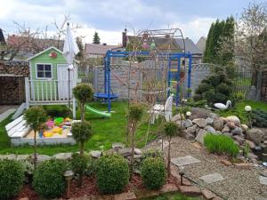 a backyard with a playground with a play equipment at Dom Adula in Janów Lubelski