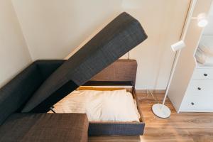 a loft bed in a room with a mattress at Lilibet Guesthouse - Lilibet Vendégház in Ciumani