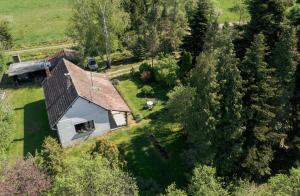 an aerial view of a house in a field at Ildikó Vendégház in Magyarszombatfa